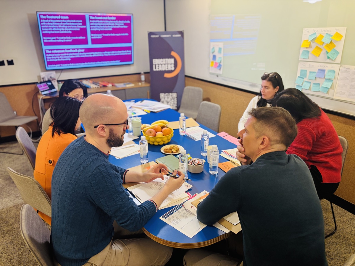 Participants working together at a coaching masterclass workshop